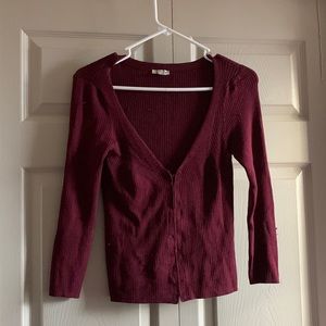 Women’s maroon sweater.